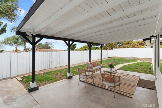 view of patio featuring outdoor lounge area and a fenced backyard