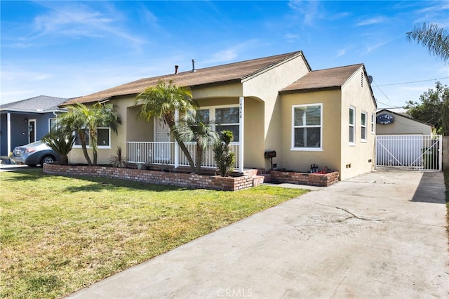 14948 Flomar Dr, Whittier, CA 90603 - view of front of house featuring covered porch, a front lawn, and stucco siding