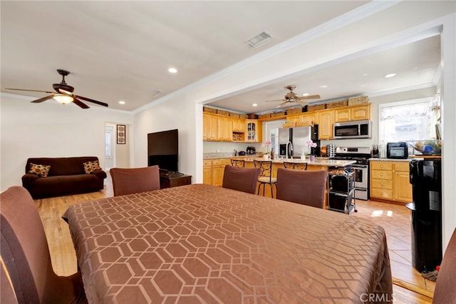 14948 Flomar Dr, Whittier, CA 90603 - bedroom with crown molding, recessed lighting, visible vents, and stainless steel fridge
