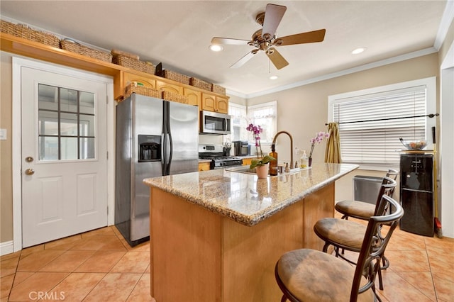 14948 Flomar Dr, Whittier, CA 90603 - kitchen with crown molding, a kitchen breakfast bar, a sink, light tile patterned floors, and stainless steel appliances