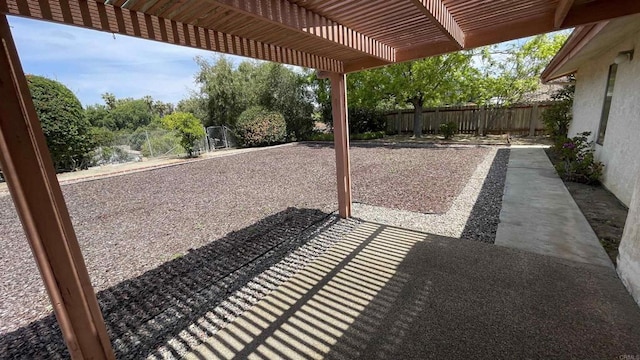 view of patio / terrace with a fenced backyard and a pergola