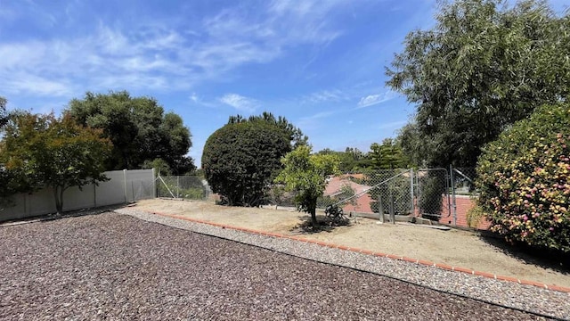 view of yard with a gate and fence