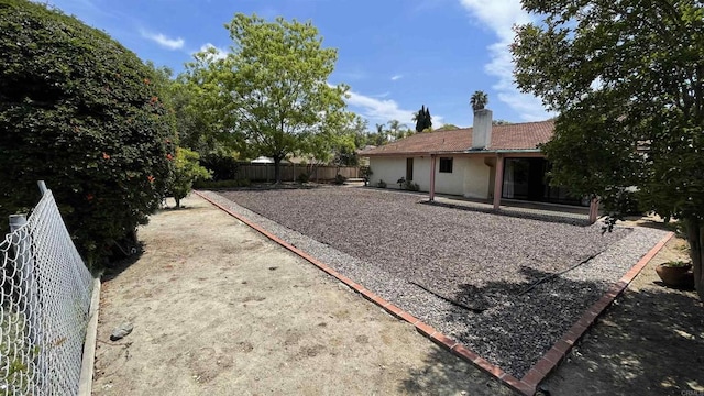 view of yard with a fenced backyard and a patio area