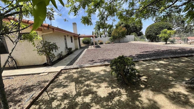 view of yard featuring a fenced backyard and a patio