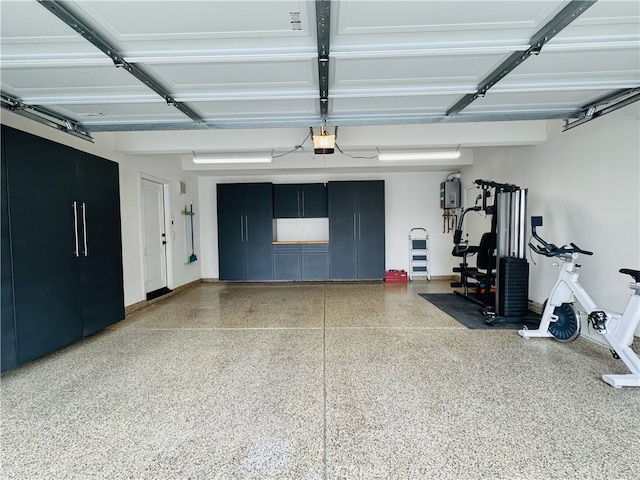 garage featuring baseboards and a garage door opener