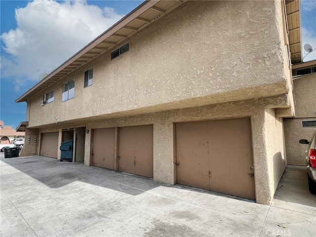 1908 E Coral Ave, Orange, CA 92865 - exterior space featuring a garage and stucco siding