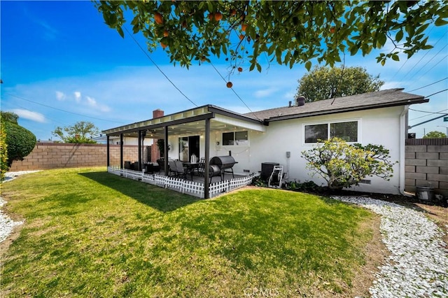 15803 Silvergrove Dr, Whittier, CA 90604 - back of property with a lawn, a patio, a fenced backyard, and stucco siding