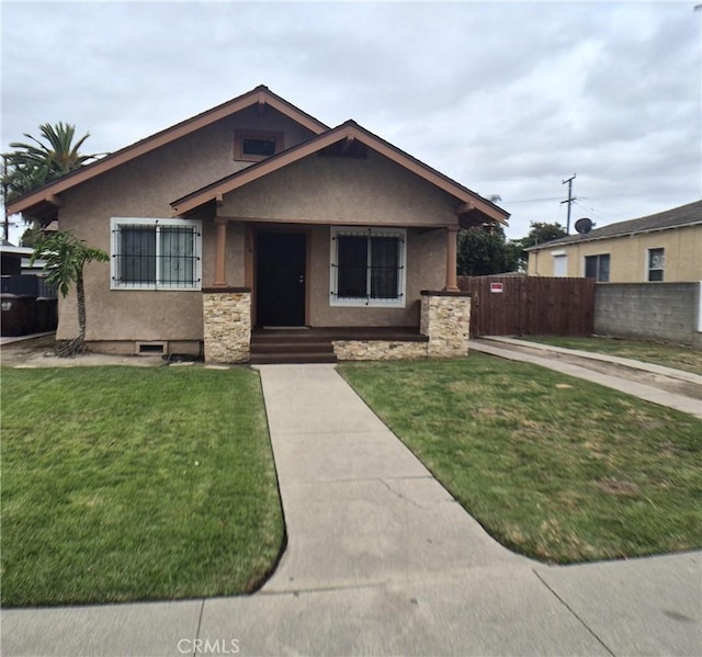 804 S Mayo Ave, Compton, CA 90221 - bungalow with fence, stucco siding, and a front yard