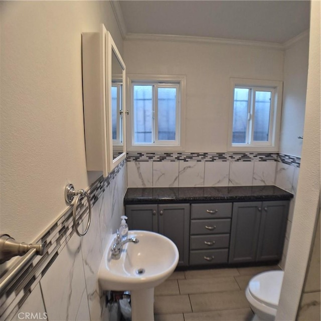 804 S Mayo Ave, Compton, CA 90221 - bathroom with a sink, crown molding, and toilet