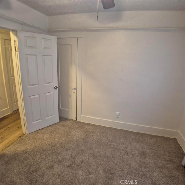 804 S Mayo Ave, Compton, CA 90221 - unfurnished bedroom featuring baseboards, a ceiling fan, and carpet floors