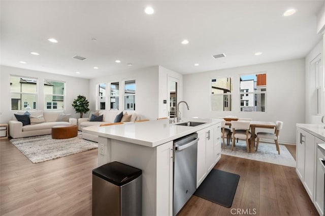 146 Fable, Irvine, CA 92618 - kitchen featuring stainless steel dishwasher, a sink, healthy amount of natural light, white cabinetry, and recessed lighting