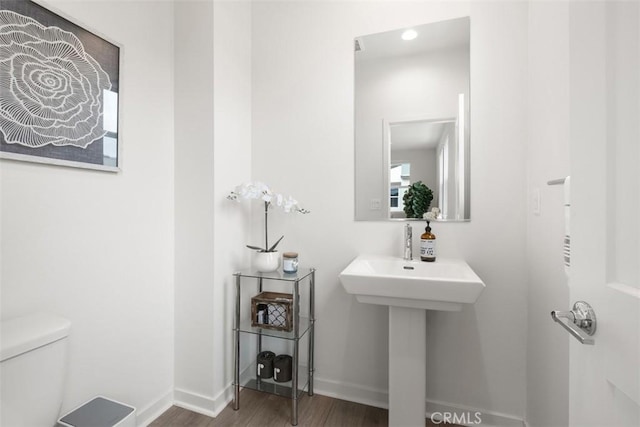 146 Fable, Irvine, CA 92618 - bathroom with wood finished floors, toilet, baseboards, and a sink