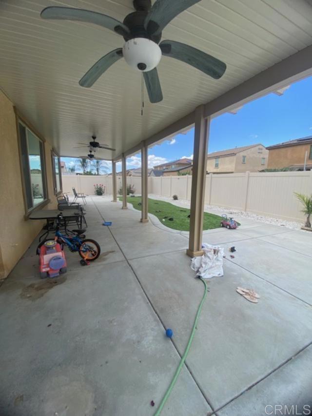 1160 Vallejo St, Perris, CA 92571 - fenced backyard featuring ceiling fan and a patio