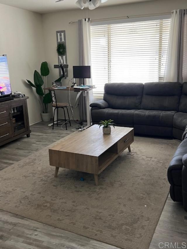 1160 Vallejo St, Perris, CA 92571 - living area featuring wood finished floors and a ceiling fan