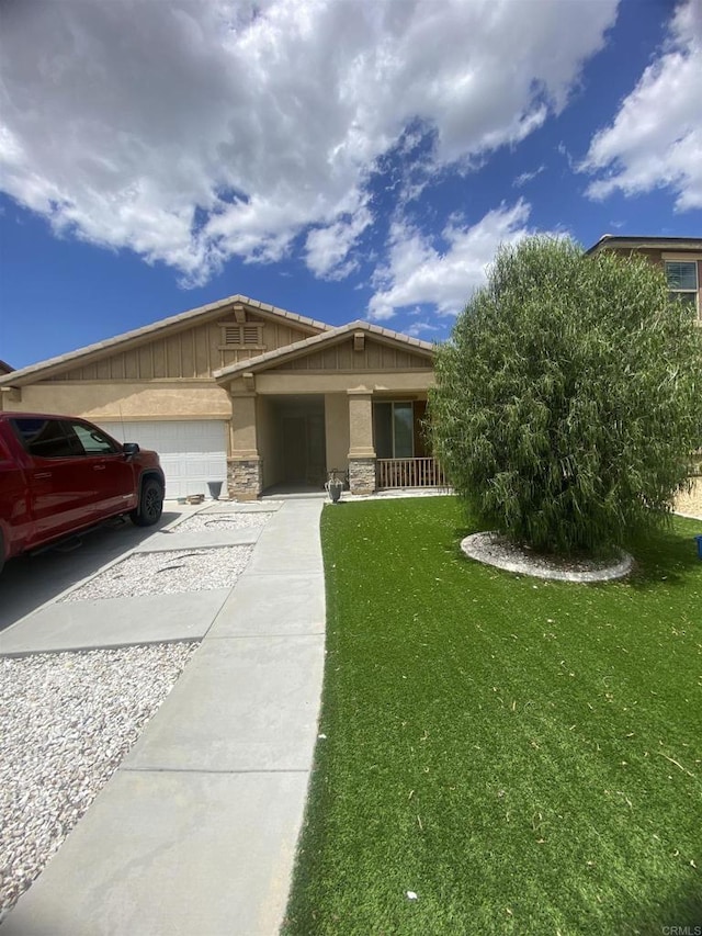 1160 Vallejo St, Perris, CA 92571 - craftsman house featuring a garage, a front lawn, driveway, and stone siding