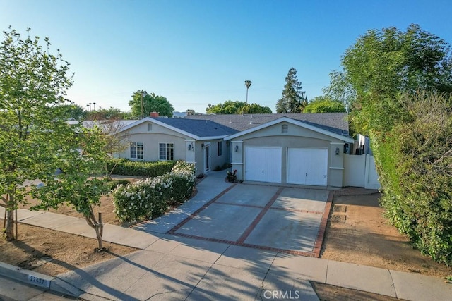 22437 Haynes St, West Hills, CA 91307 - single story home featuring fence, a garage, stucco siding, and driveway
