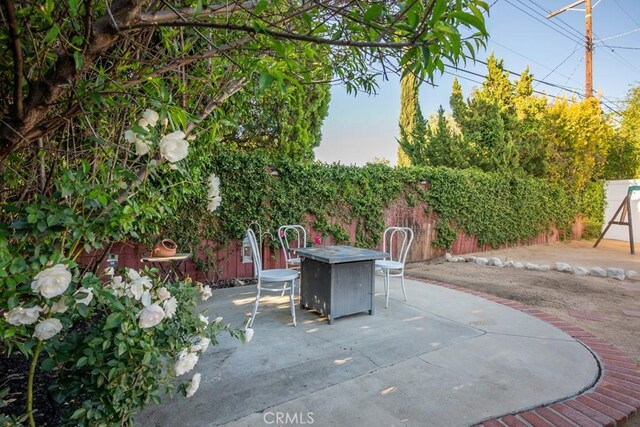 22437 Haynes St, West Hills, CA 91307 - view of patio with a fire pit and fence