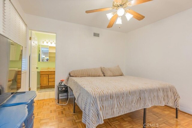 22437 Haynes St, West Hills, CA 91307 - bedroom with ensuite bath, visible vents, a ceiling fan, and a sink