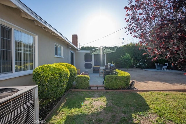 22437 Haynes St, West Hills, CA 91307 - view of yard featuring central AC unit and a patio