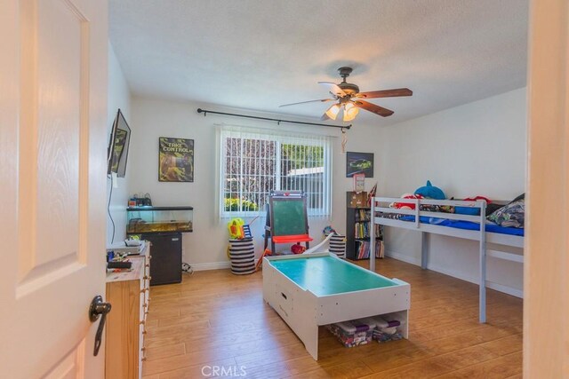 22437 Haynes St, West Hills, CA 91307 - bedroom featuring baseboards, light wood-type flooring, and a ceiling fan