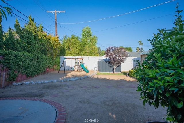 22437 Haynes St, West Hills, CA 91307 - view of yard featuring a fenced backyard and a playground