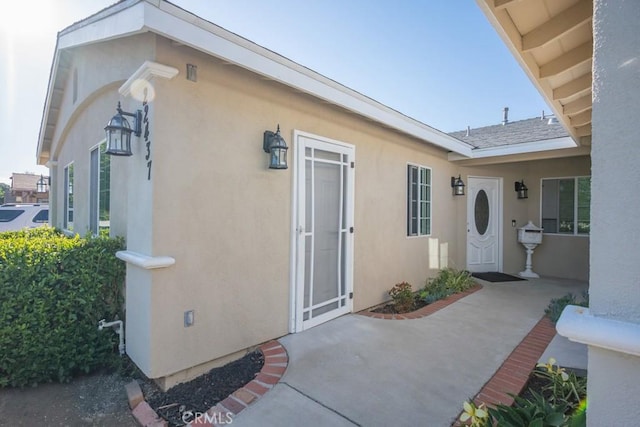 22437 Haynes St, West Hills, CA 91307 - view of exterior entry featuring a patio area and stucco siding