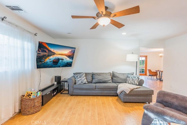 22437 Haynes St, West Hills, CA 91307 - living room featuring visible vents, wood finished floors, ceiling fan with notable chandelier, and recessed lighting