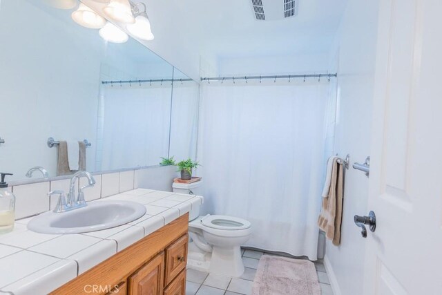 22437 Haynes St, West Hills, CA 91307 - bathroom featuring toilet, tile patterned flooring, vanity, and visible vents