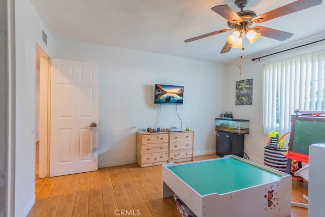 22437 Haynes St, West Hills, CA 91307 - recreation room with light wood-type flooring, visible vents, baseboards, and ceiling fan