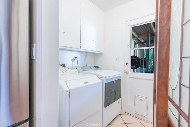 22437 Haynes St, West Hills, CA 91307 - laundry room with cabinet space, light tile patterned floors, and washer and dryer