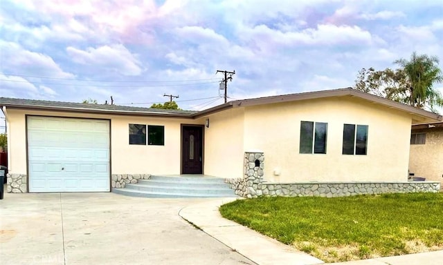 single story home featuring stone siding, a garage, stucco siding, a front yard, and driveway
