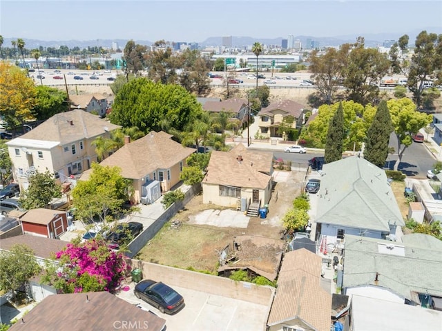 birds eye view of property with a view of city and a residential view