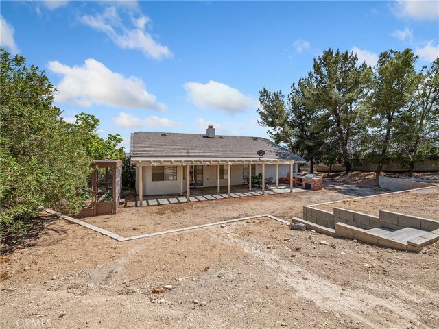 18668 Kamana Rd, Apple Valley, CA 92307 - rear view of house with a patio area and a chimney