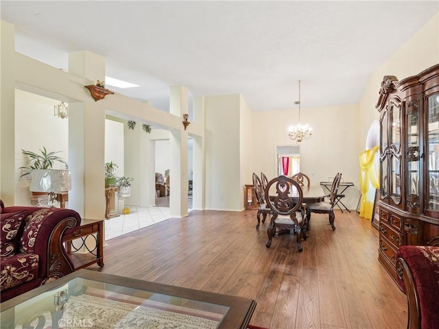 18668 Kamana Rd, Apple Valley, CA 92307 - dining space featuring an inviting chandelier and hardwood / wood-style flooring