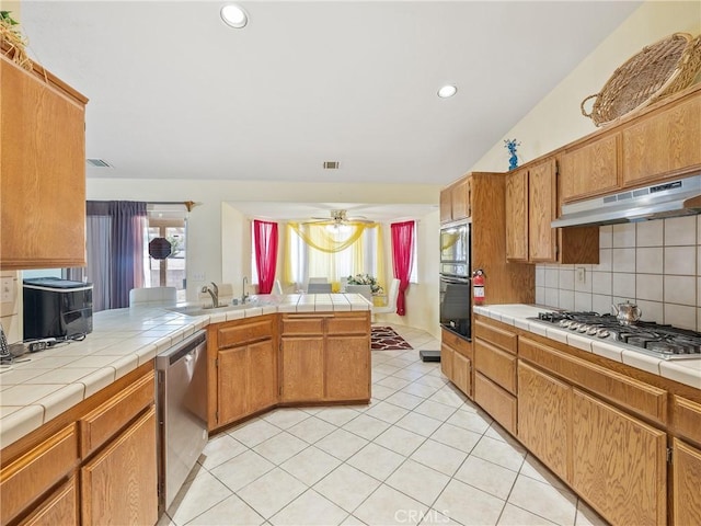 18668 Kamana Rd, Apple Valley, CA 92307 - kitchen with decorative backsplash, gas cooktop, under cabinet range hood, a sink, and dishwasher