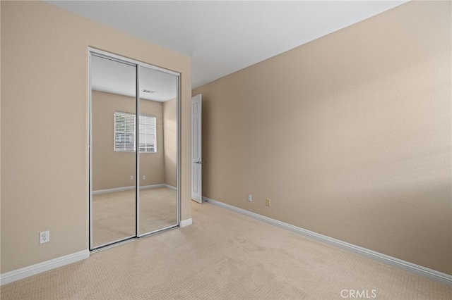 562 Silverhawk Dr, Corona, CA 92879 - unfurnished bedroom featuring carpet floors, baseboards, and a closet