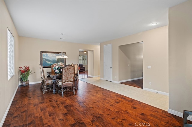 562 Silverhawk Dr, Corona, CA 92879 - dining space featuring wood finished floors, a chandelier, and baseboards