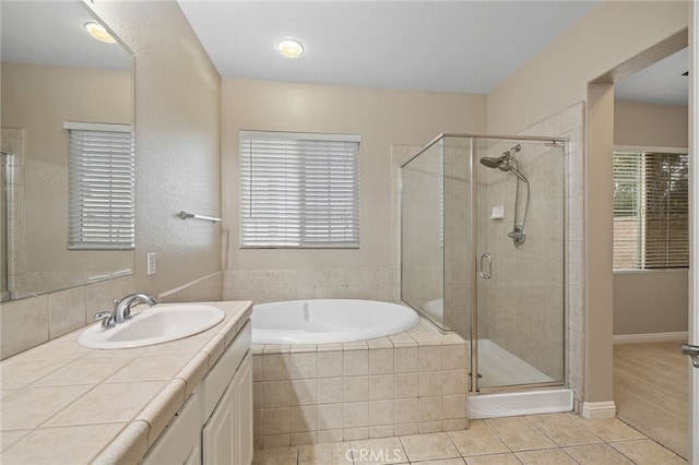 562 Silverhawk Dr, Corona, CA 92879 - bathroom with tile patterned flooring, a stall shower, a garden tub, and vanity