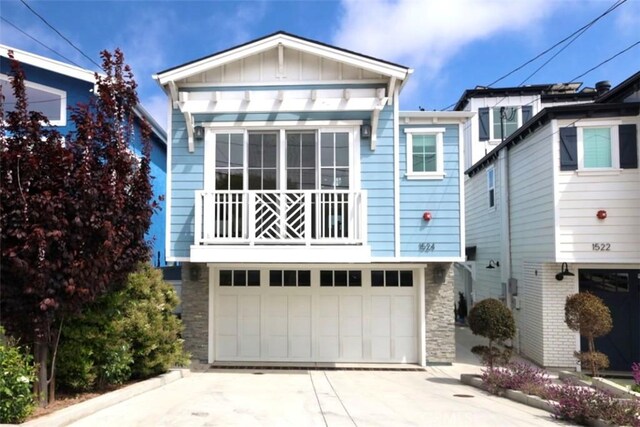 1524 Wollacott St, Redondo Beach, CA 90278 - view of front of property with board and batten siding, concrete driveway, and a garage