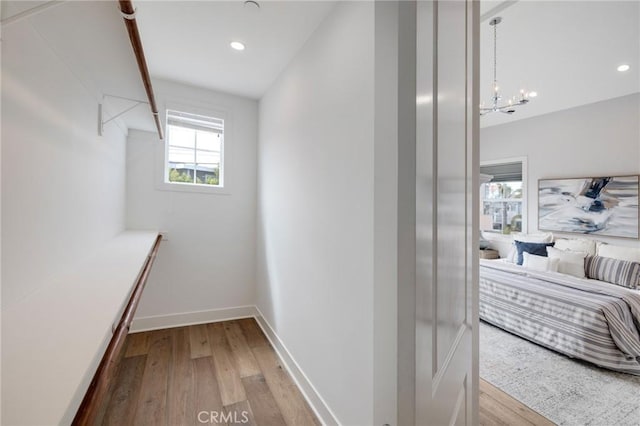 1524 Wollacott St, Redondo Beach, CA 90278 - walk in closet featuring wood finished floors and a chandelier