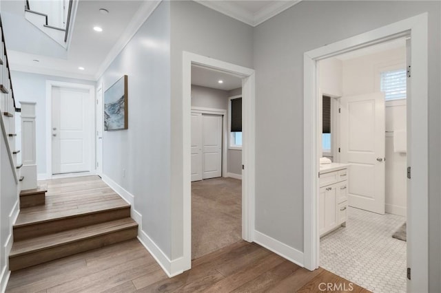 1524 Wollacott St, Redondo Beach, CA 90278 - hallway with stairs, light wood-style floors, ornamental molding, baseboards, and recessed lighting