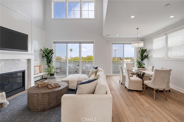 1524 Wollacott St, Redondo Beach, CA 90278 - living area featuring light wood finished floors, baseboards, a chandelier, a towering ceiling, and recessed lighting