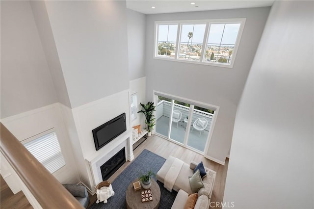 1524 Wollacott St, Redondo Beach, CA 90278 - living room with wood finished floors, a towering ceiling, a fireplace, and recessed lighting
