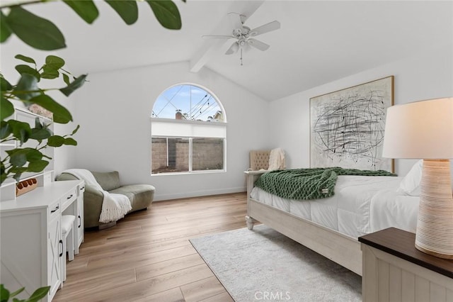 6582 Corrine Cir, Huntington Beach, CA 92647 - bedroom with baseboards, vaulted ceiling with beams, a ceiling fan, and light wood-style flooring