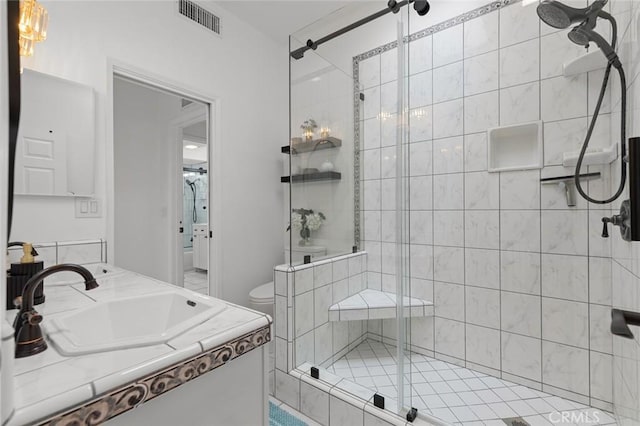 6582 Corrine Cir, Huntington Beach, CA 92647 - bathroom featuring vanity, toilet, visible vents, and a stall shower