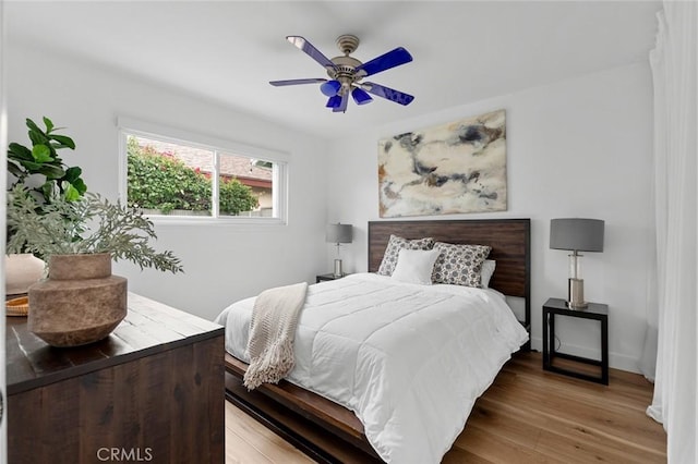 6582 Corrine Cir, Huntington Beach, CA 92647 - bedroom with a ceiling fan, baseboards, and light wood-type flooring