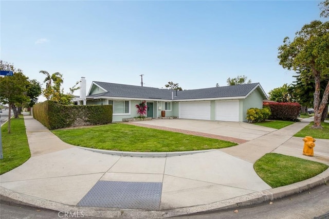 6582 Corrine Cir, Huntington Beach, CA 92647 - ranch-style house with stucco siding, an attached garage, driveway, and a front lawn