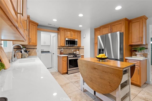 6582 Corrine Cir, Huntington Beach, CA 92647 - kitchen featuring a sink, stainless steel appliances, recessed lighting, backsplash, and visible vents