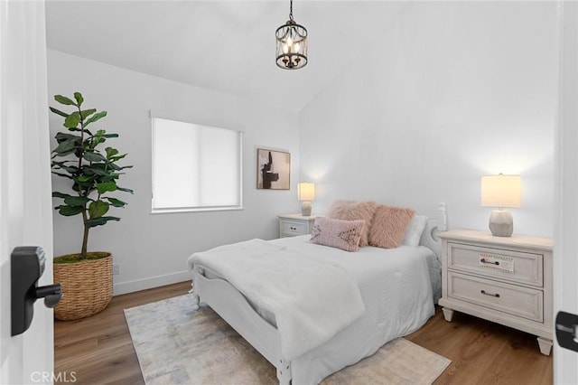 6582 Corrine Cir, Huntington Beach, CA 92647 - bedroom with dark wood-type flooring, baseboards, and vaulted ceiling