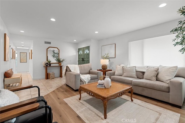 6582 Corrine Cir, Huntington Beach, CA 92647 - living area with light wood finished floors, recessed lighting, and visible vents